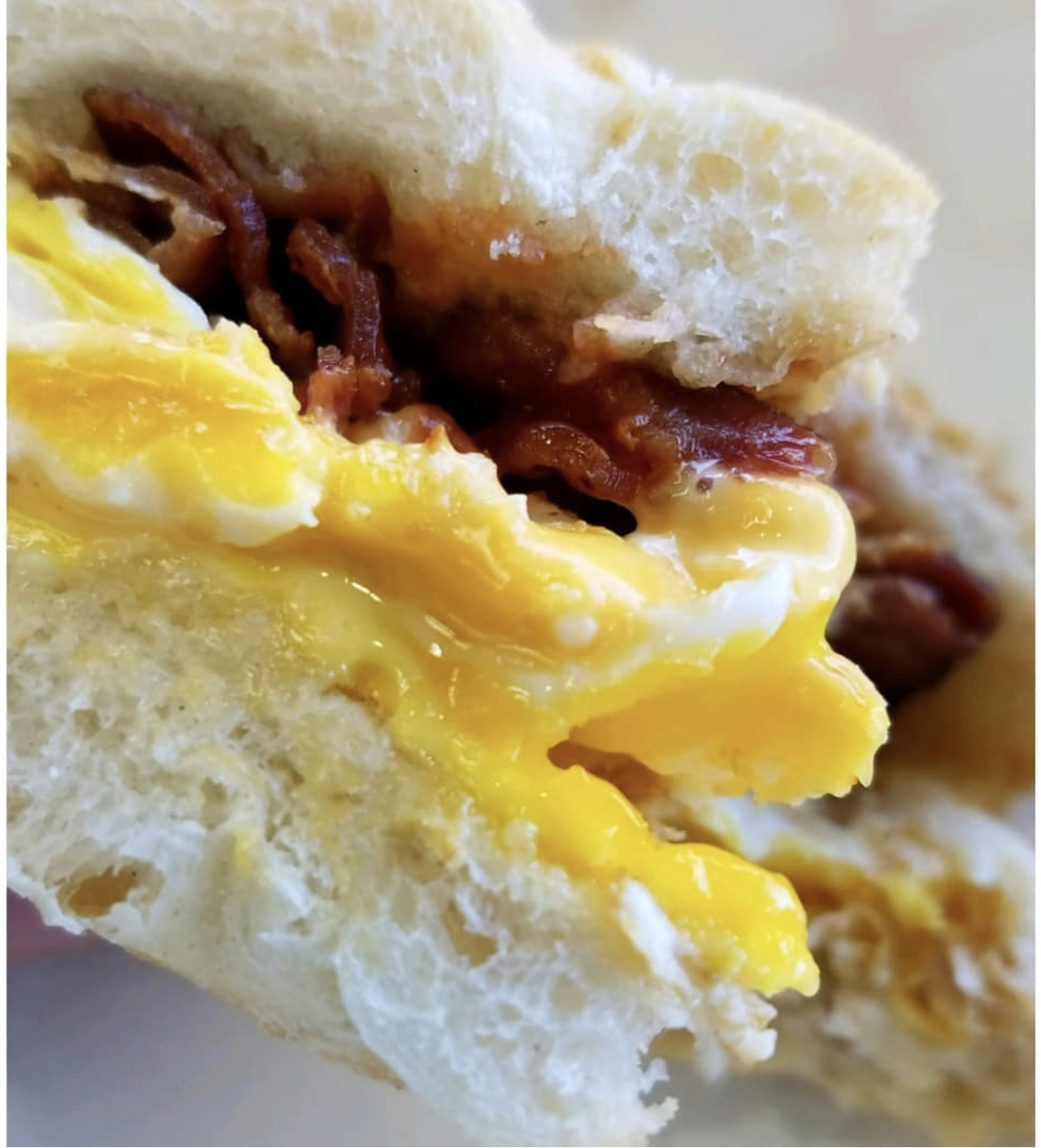 Bacon, Egg and Cheese on a Roll at John & Sons Deli